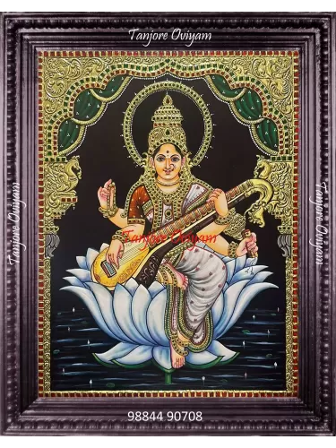 Authentic Saraswathi Tanjore painting of Goddess Saraswathi seated on a lotus with veena and gold foil detailing
